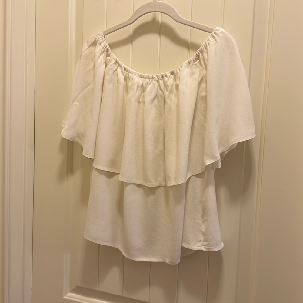 Holding Horses,  white ruffle top.